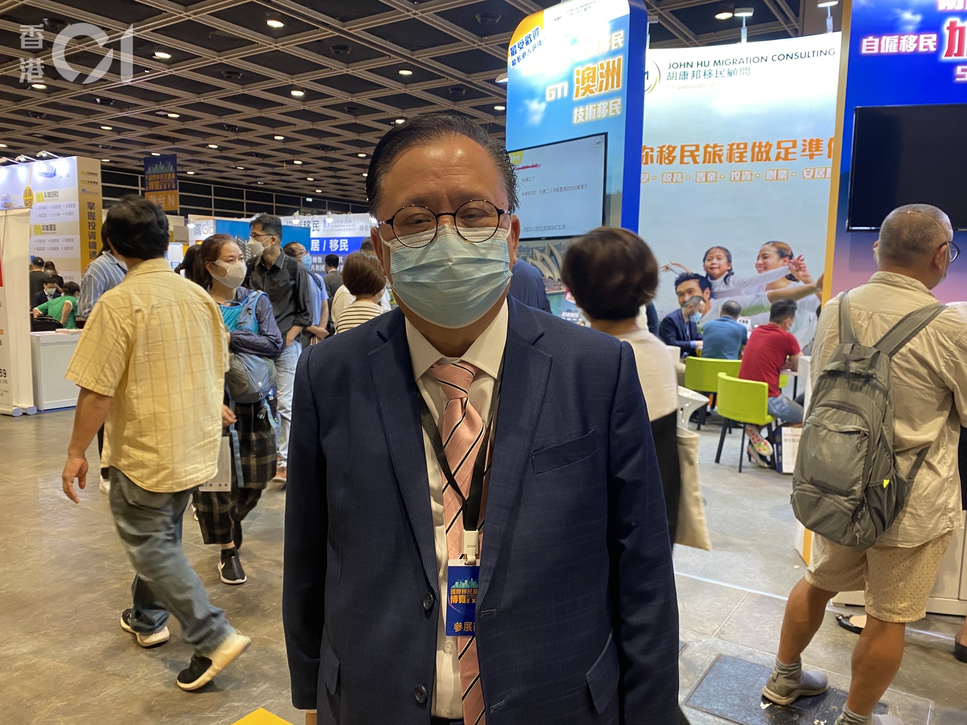 John Hu at an immigration expo